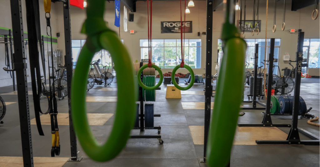 green hanging rings in a gym green hanging rings in a gym