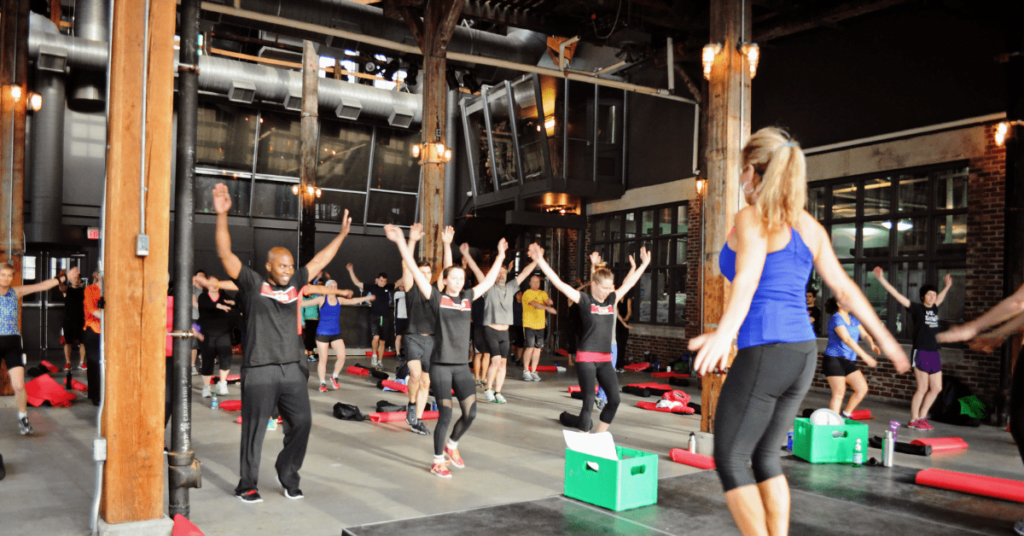 fitness instructor leads class fitness instructor leads class