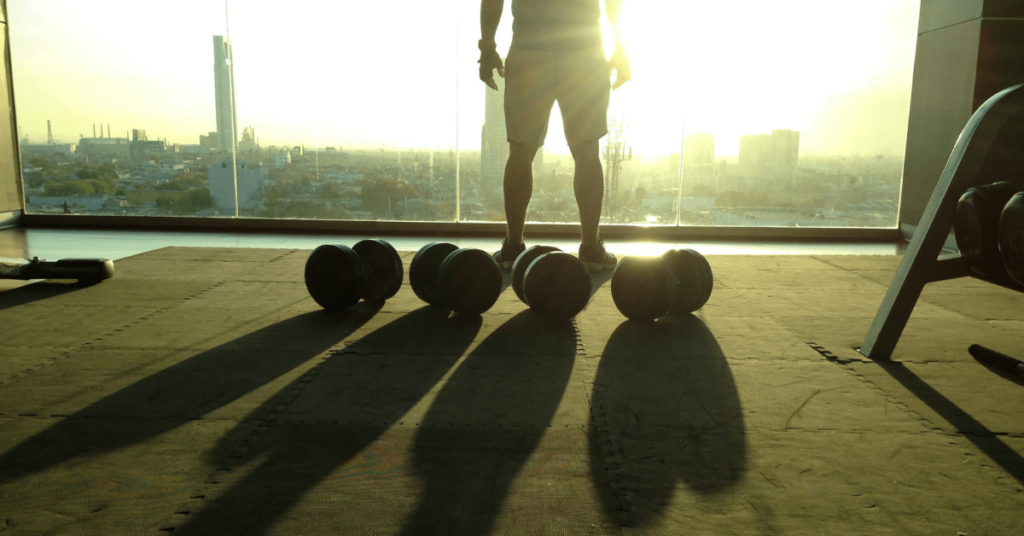 man at a window staring out over the city man at a window staring out over the city
