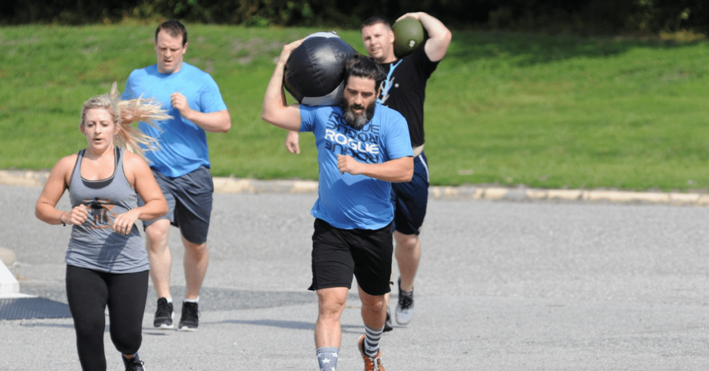 four people running in a park four people running in a park