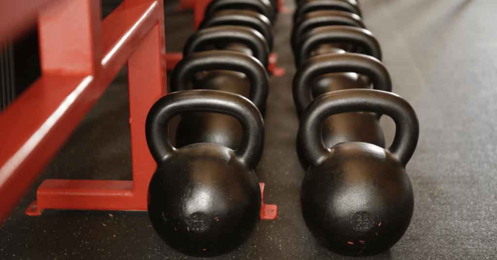 two lines of black kettlebells two lines of black kettlebells
