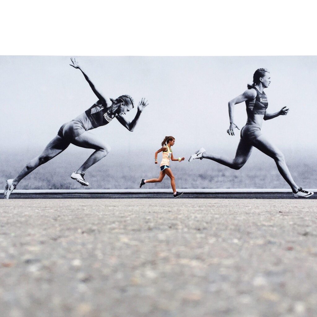person running beside billboard person running beside billboard
