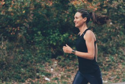 happy smiling woman running