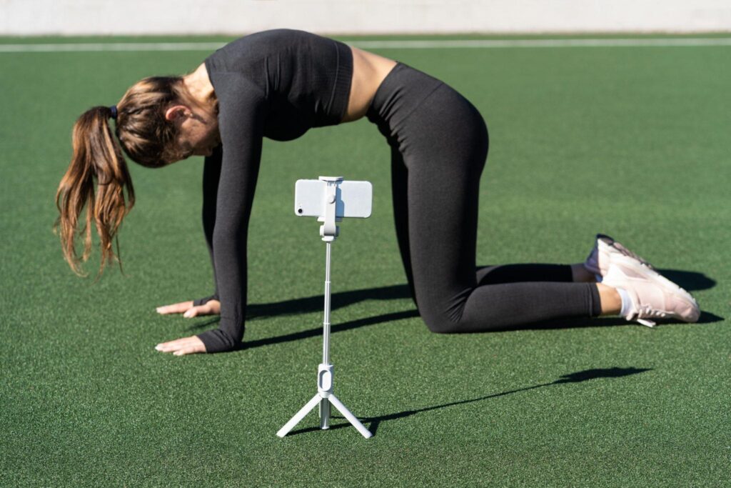 woman doing yoga pose in front of camera woman doing yoga pose in front of camera