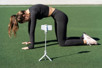 woman doing yoga pose in front of camera