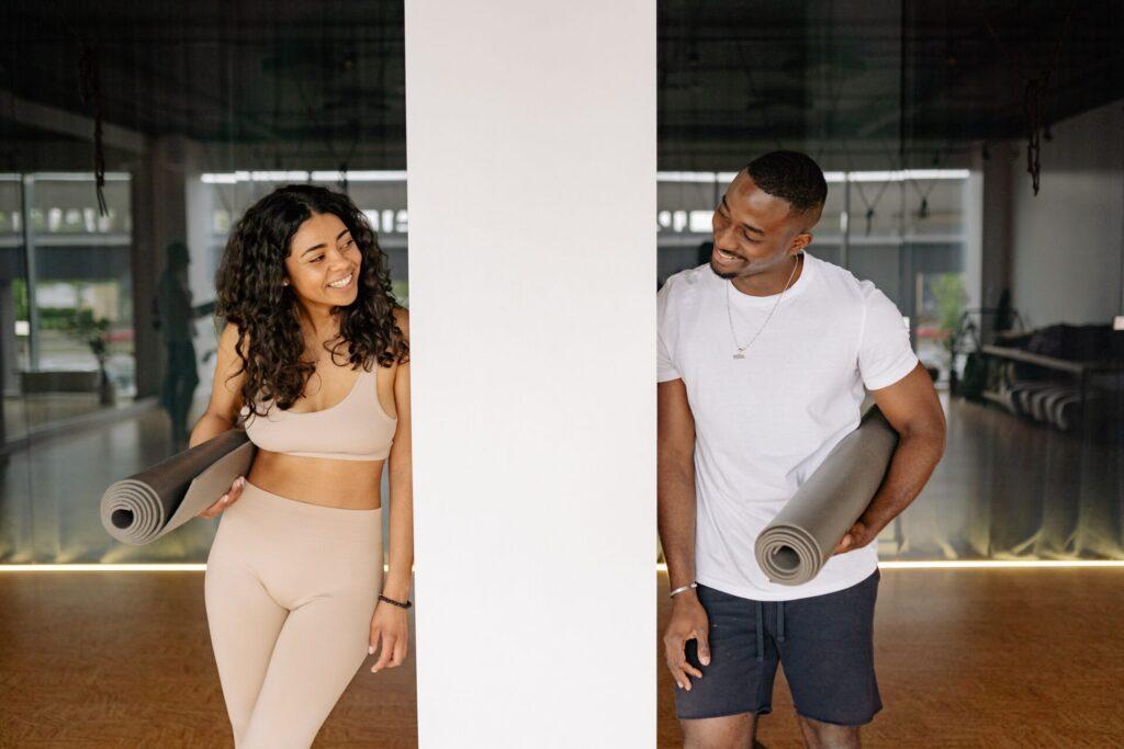 man and woman take yoga class man and woman take yoga class